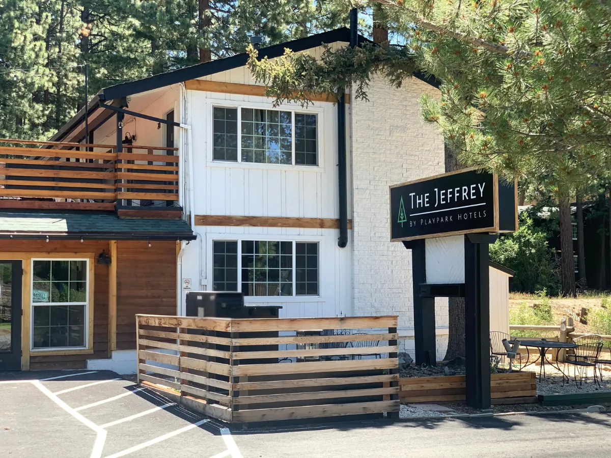 The Jeffrey Hotel exterior in South Lake Tahoe with modern wood and white facade